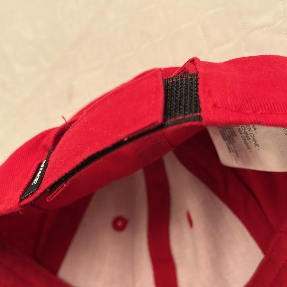 Nike red infant adjustable baseball hat with black swoosh